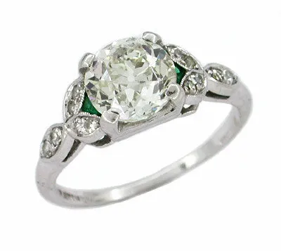 Antique 1.60 Carat Old Mine Cut Diamond and Side Emerald Platinum Engagement Ring